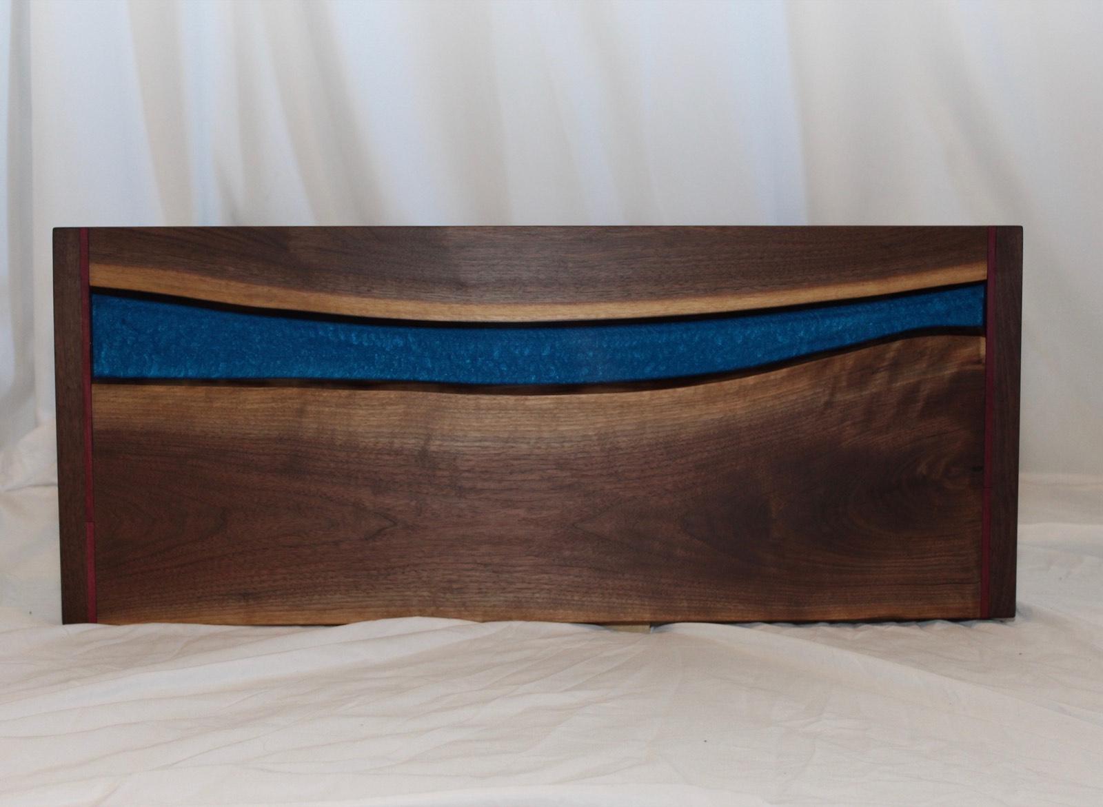 Custom Black Walnut table, blue epoxy, walnut and purpleheart border, hardwax oil finish. ~ 28″x13″