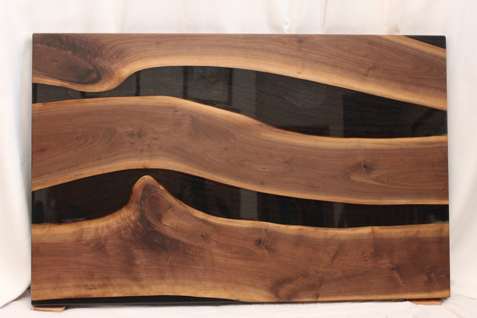 Black Walnut with Black epoxy river. Hardwax oil finish. ~49″x31″