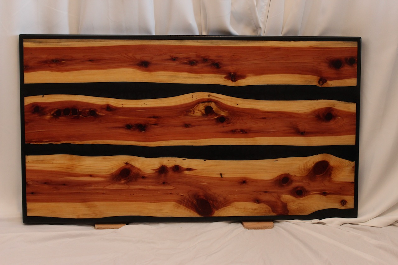 Red Cedar Coffee table with Black epoxy river and border feature. Signature Epoxy Finish. ~44″x24″